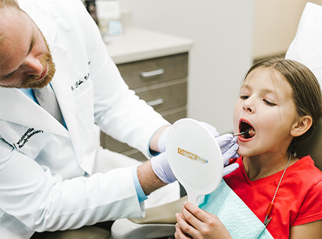 Child receiving dental exam