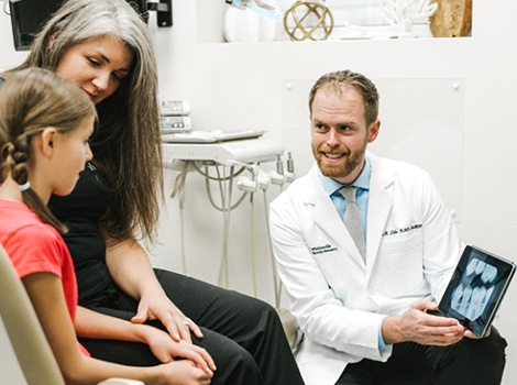 Dr. Tubo talking to patients