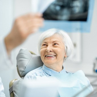 :patient smiling during consultation  