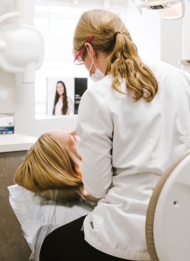 Dentist in Whitinsville treating dental patient