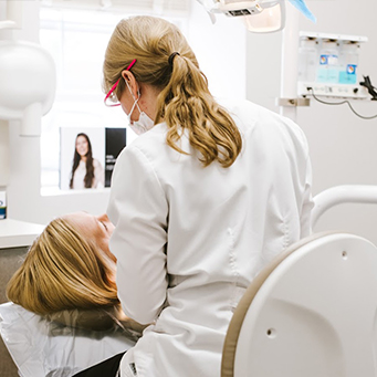 dentist examining a patient’s mouth 