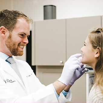 Dentist performing a dental exam