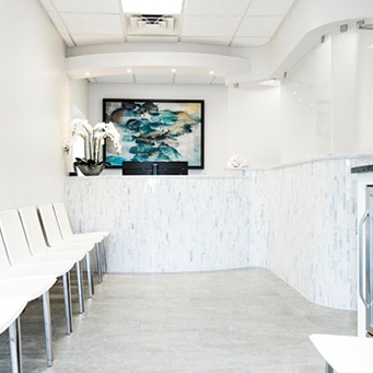 empty hallway of a dental office with a TV on the wall