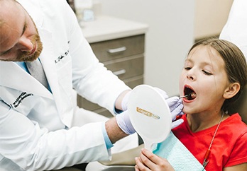 Child receiving dental exam