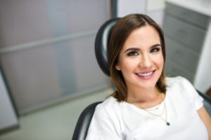 Woman smiling in dental chair with healthy teeth