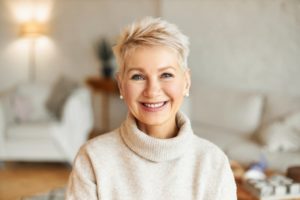 Woman smiling while wearing a turtle neck