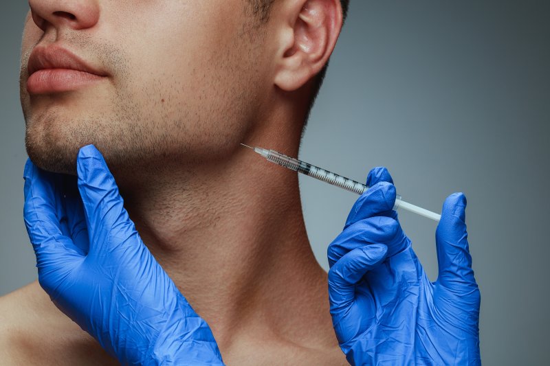 closeup of man getting BOTOX injections