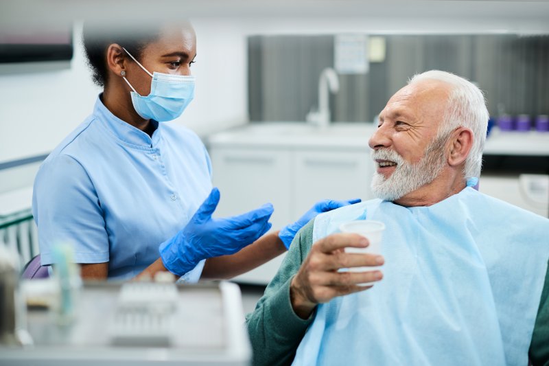 person at the dentist to receive dentures