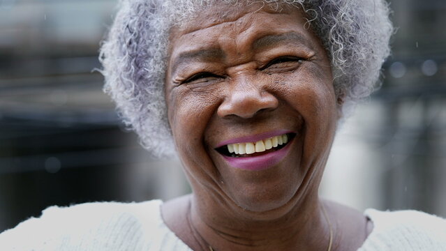 person smiling after having lower denture fixed