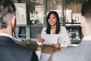 Young woman at work sitting at a table.