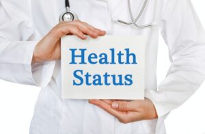 Doctor holding sign that says, “health status”