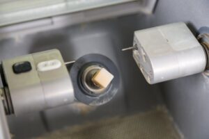 CEREC milling machine preparing to sculpt a crown